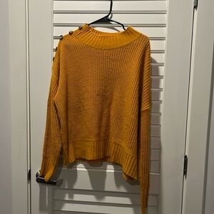 Gold long sleeve sweater.
Worn but no snags